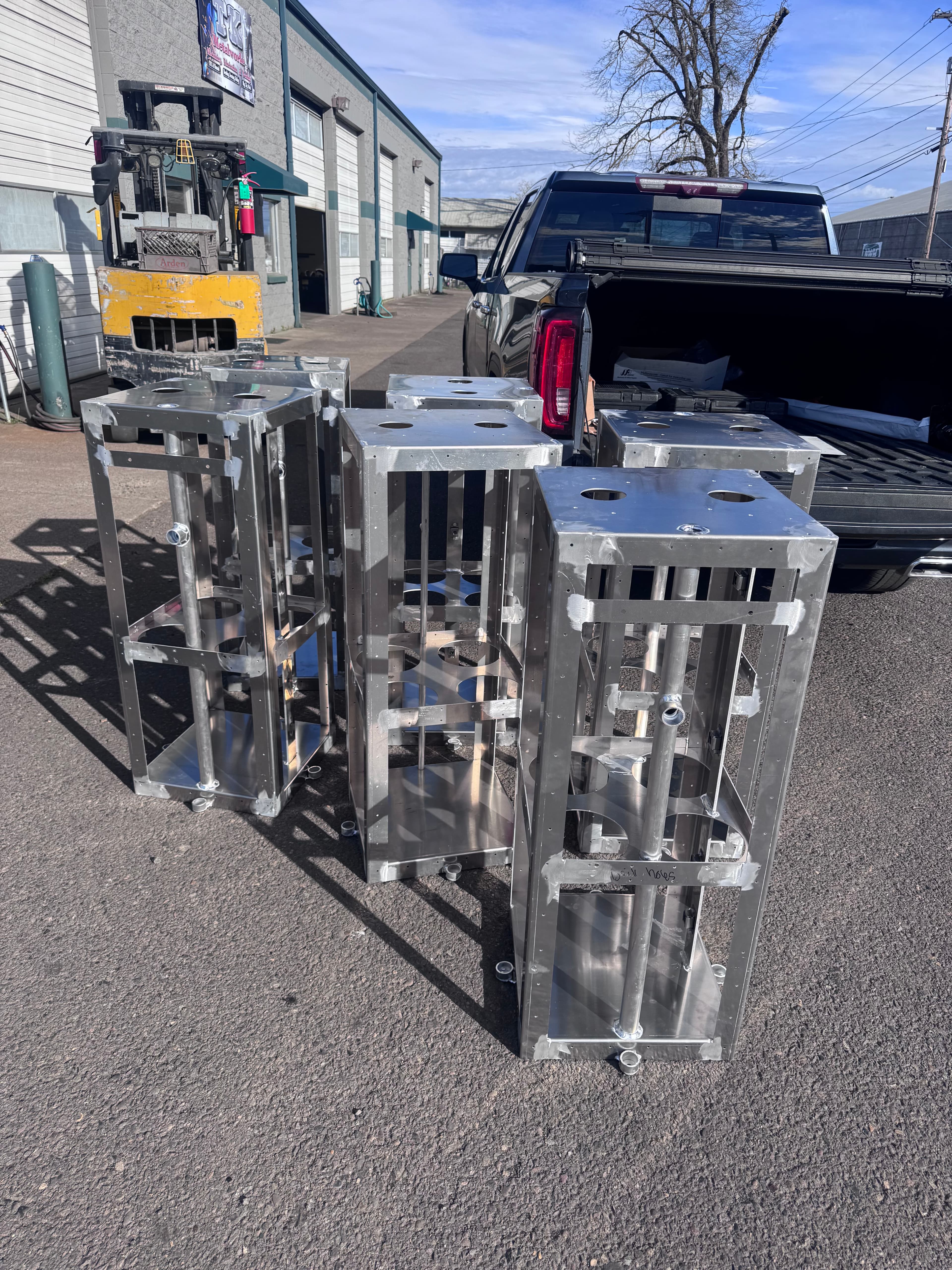 Raw steel SquareVac frames loaded on flatbed for transport