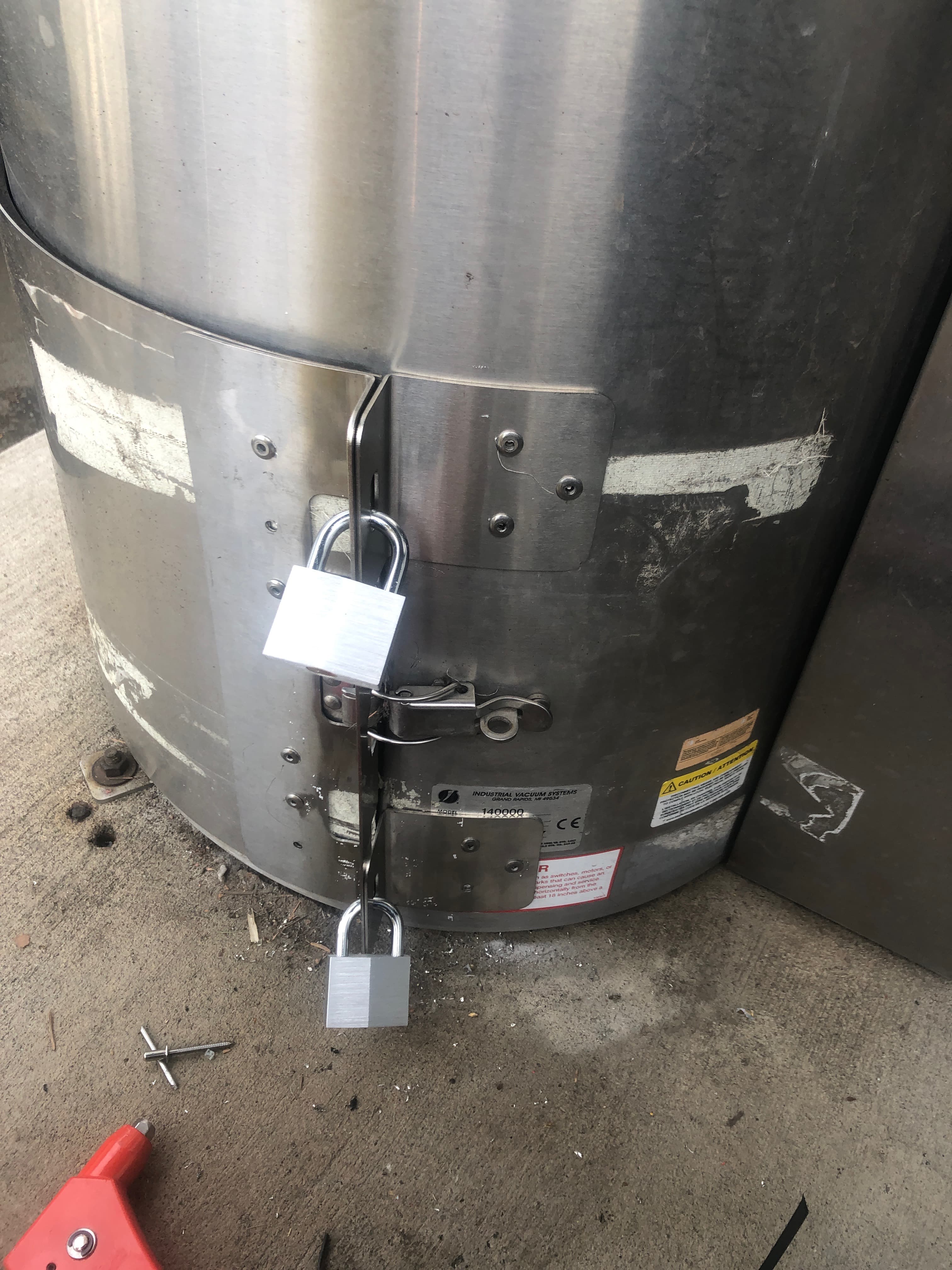 Padlocks on vacuum canister - easily defeated by thieves