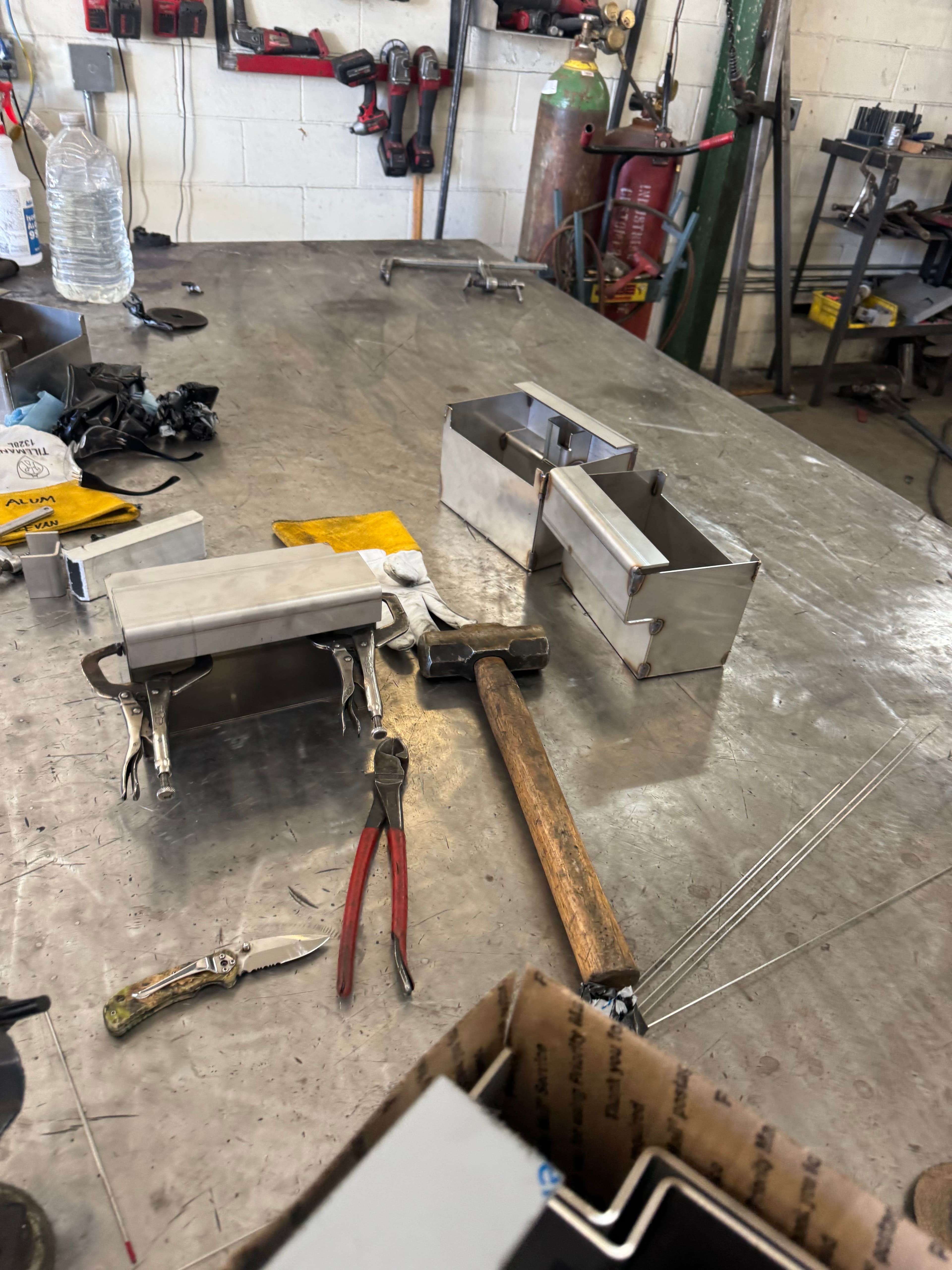 Welding jig with metal frame clamped for fabrication