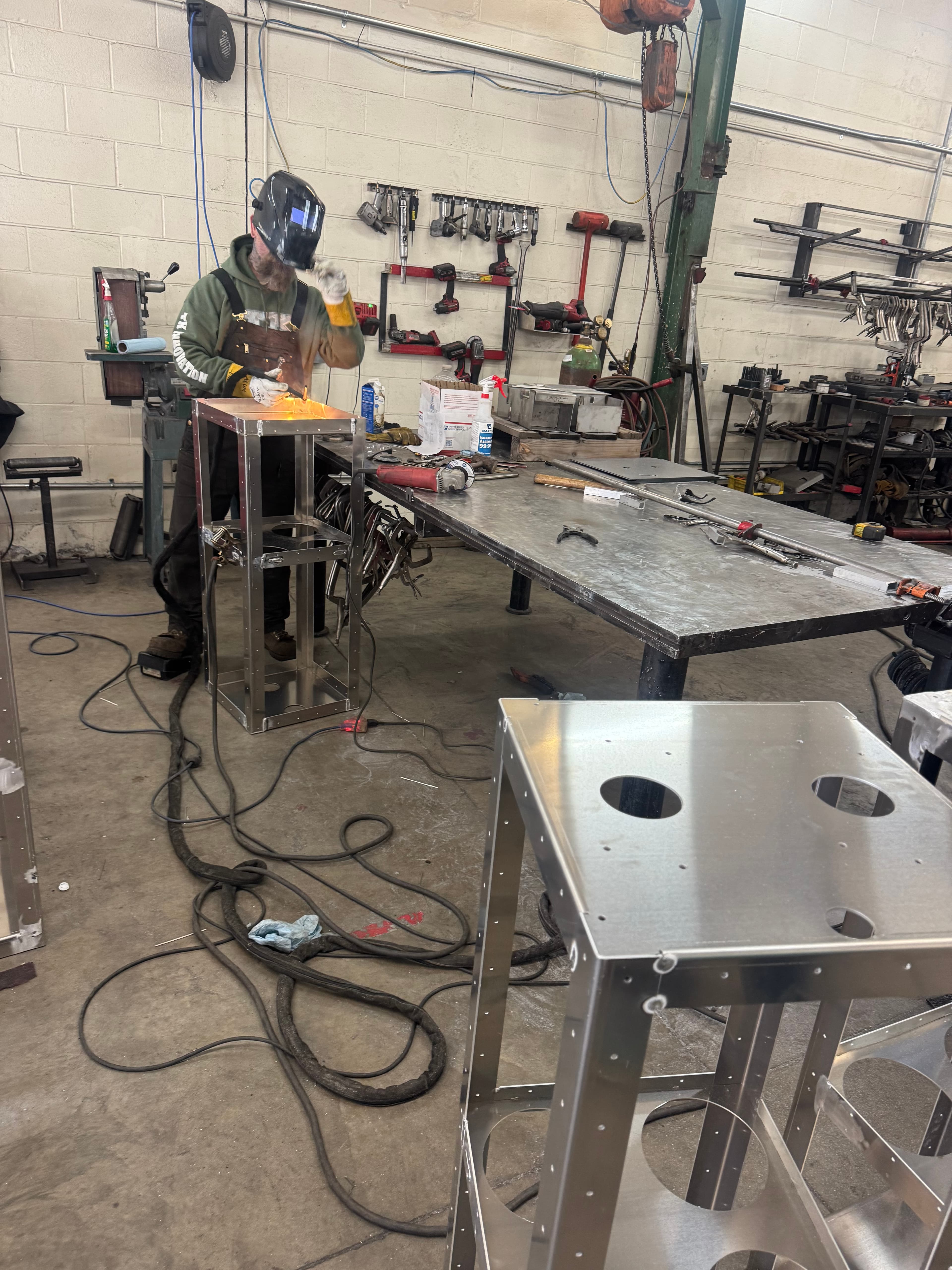 SquareVac canister bodies in various stages of assembly