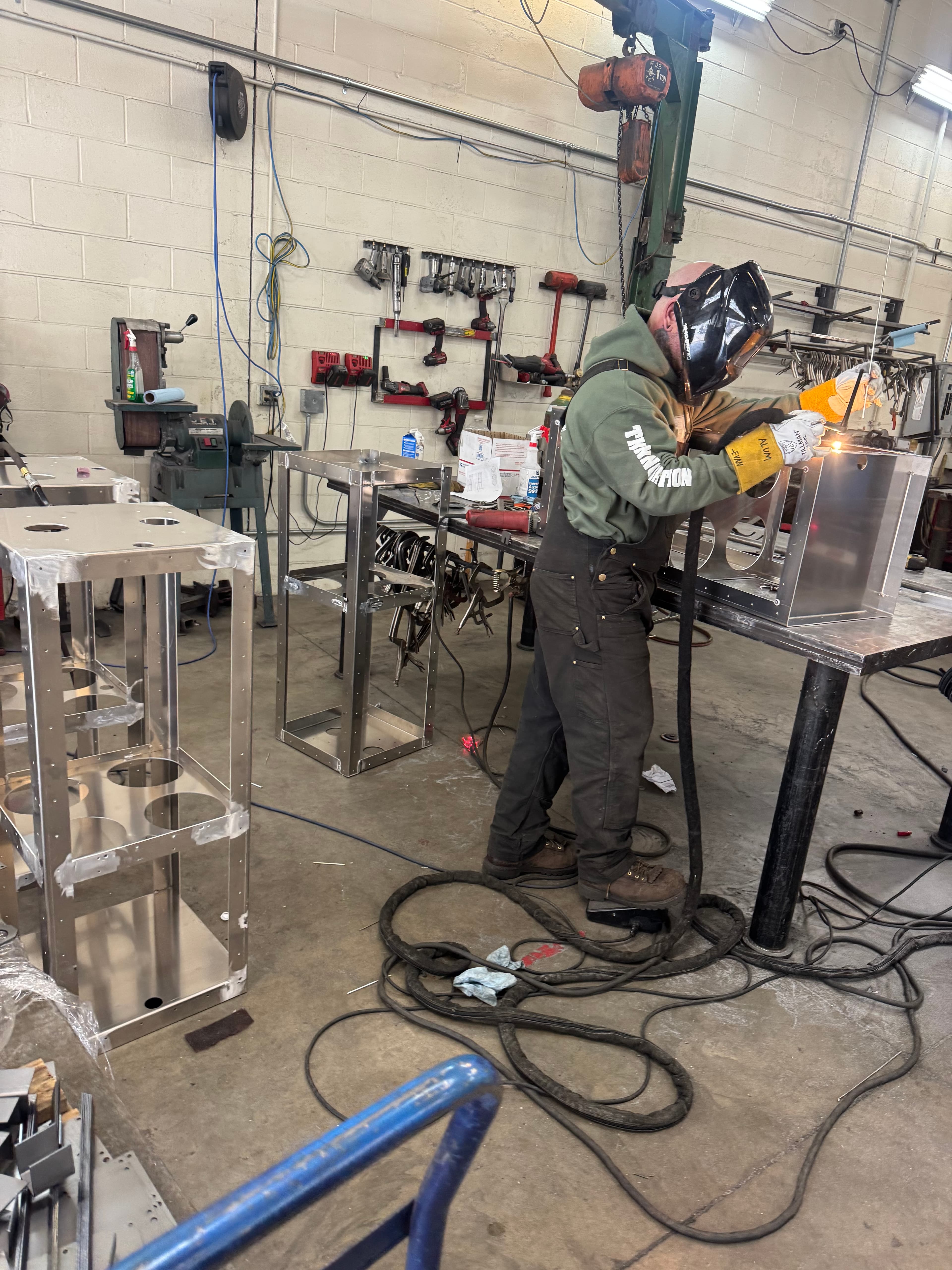 Welder in full gear welding SquareVac stainless steel seams